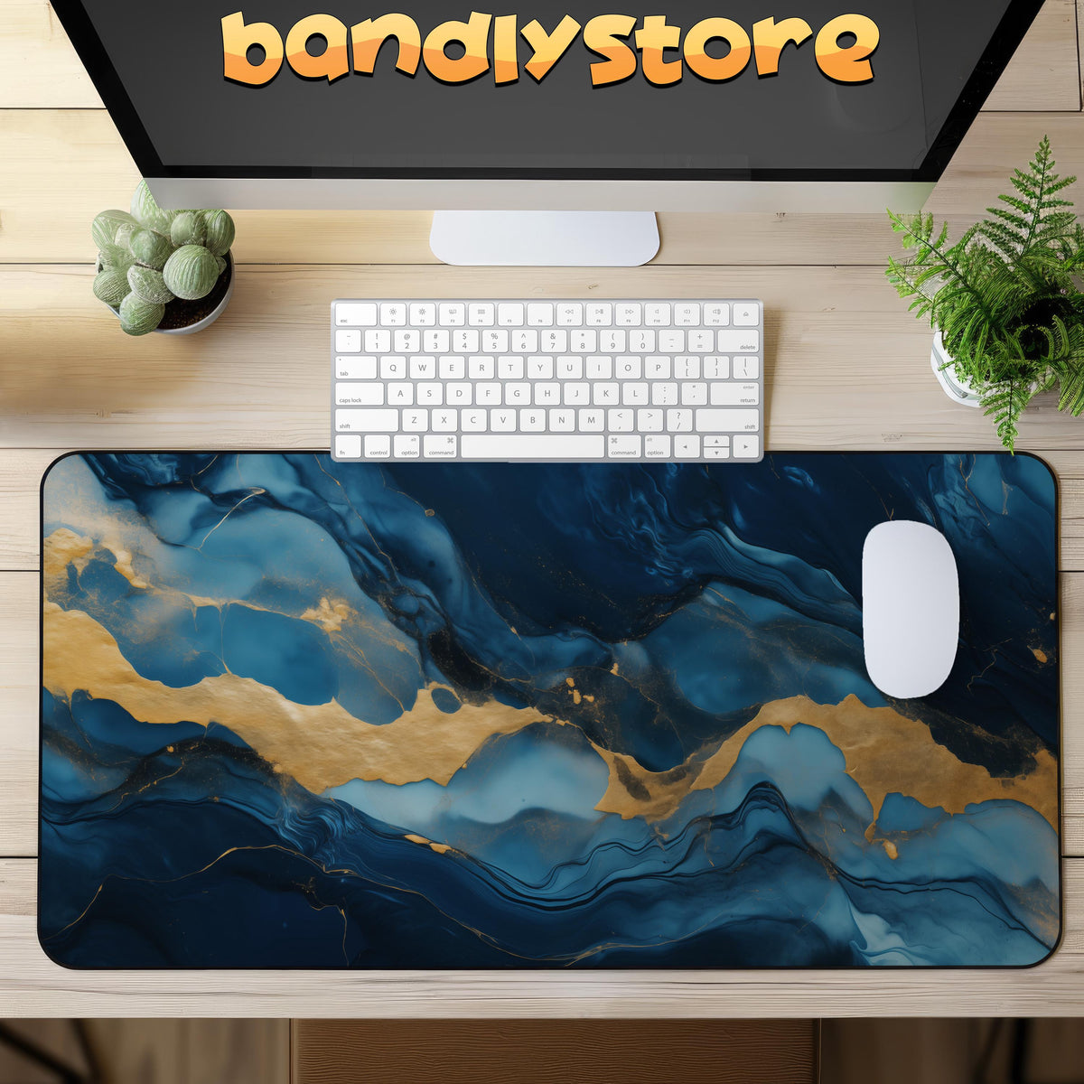 Abstract Marble Desk Mat in overhead view on a wooden desk with keyboard, mouse, monitor and plants.