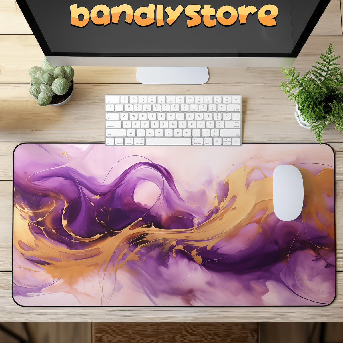 Abstract Purple And Gold Desk Mat on a wooden desk under a monitor, with keyboard, mouse and plants.