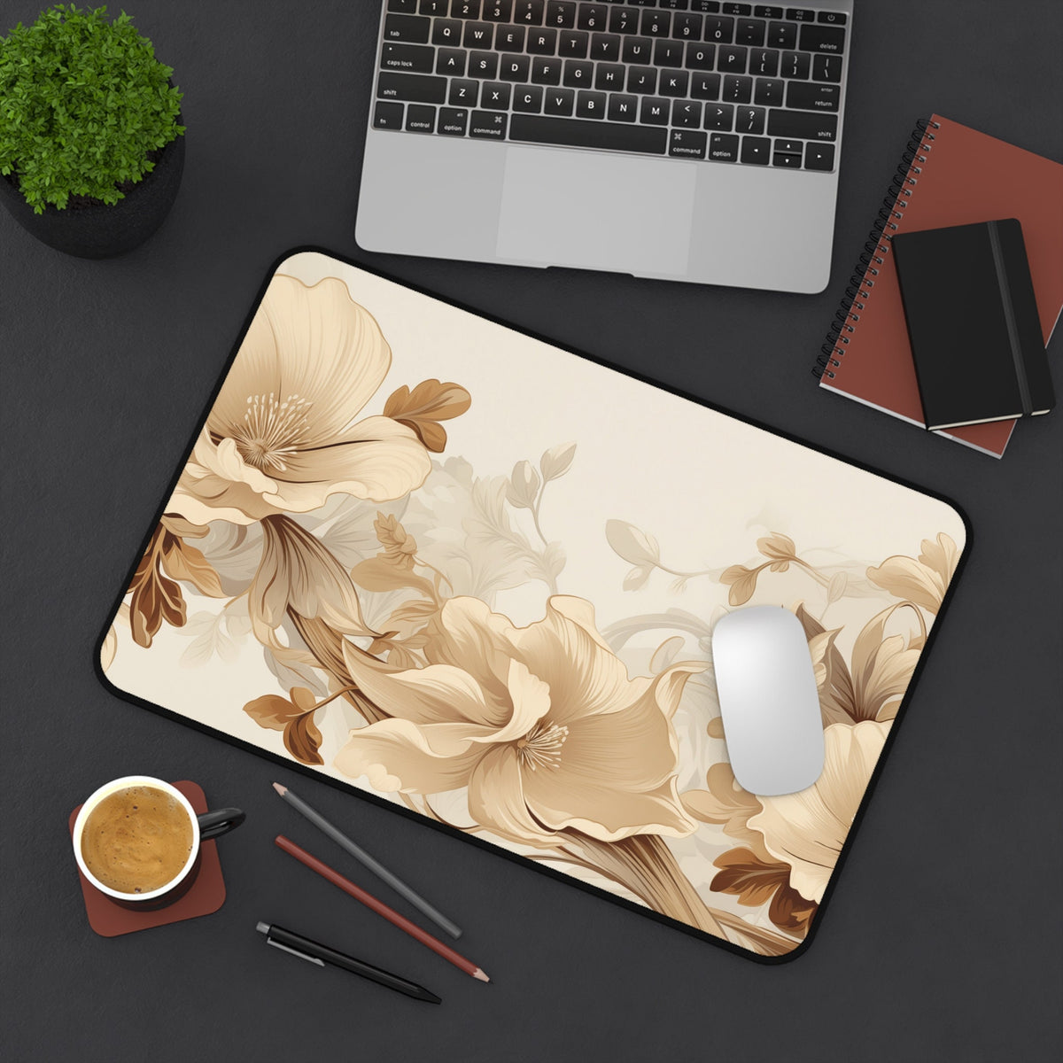 Art Nouveau Floral Desk Mat on a dark desk with laptop, mouse, coffee, pencils and notebooks, 12 × 18 inches.