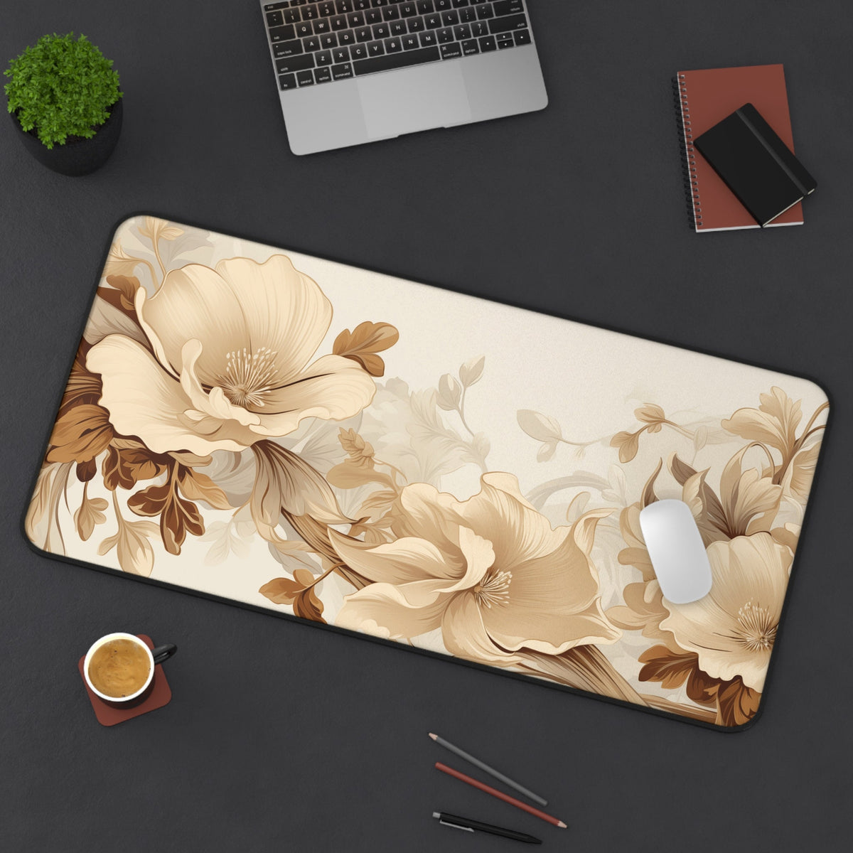 Art Nouveau Floral Desk Mat on a dark desk with laptop, plant, coffee, notebooks and mouse; 16 × 32 inches.