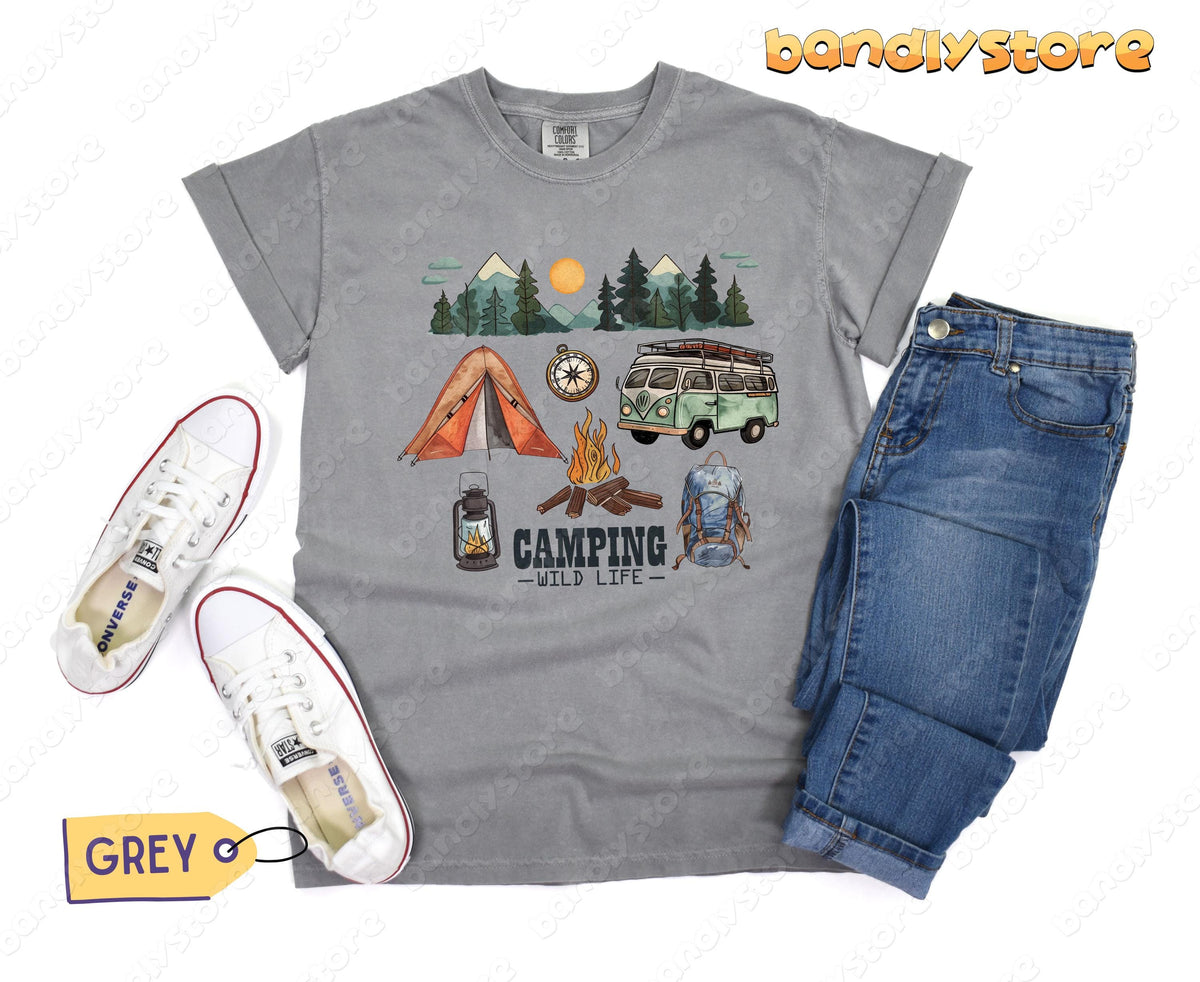 Happy Camper T-Shirt in grey top-down flat lay beside white sneakers and blue jeans.