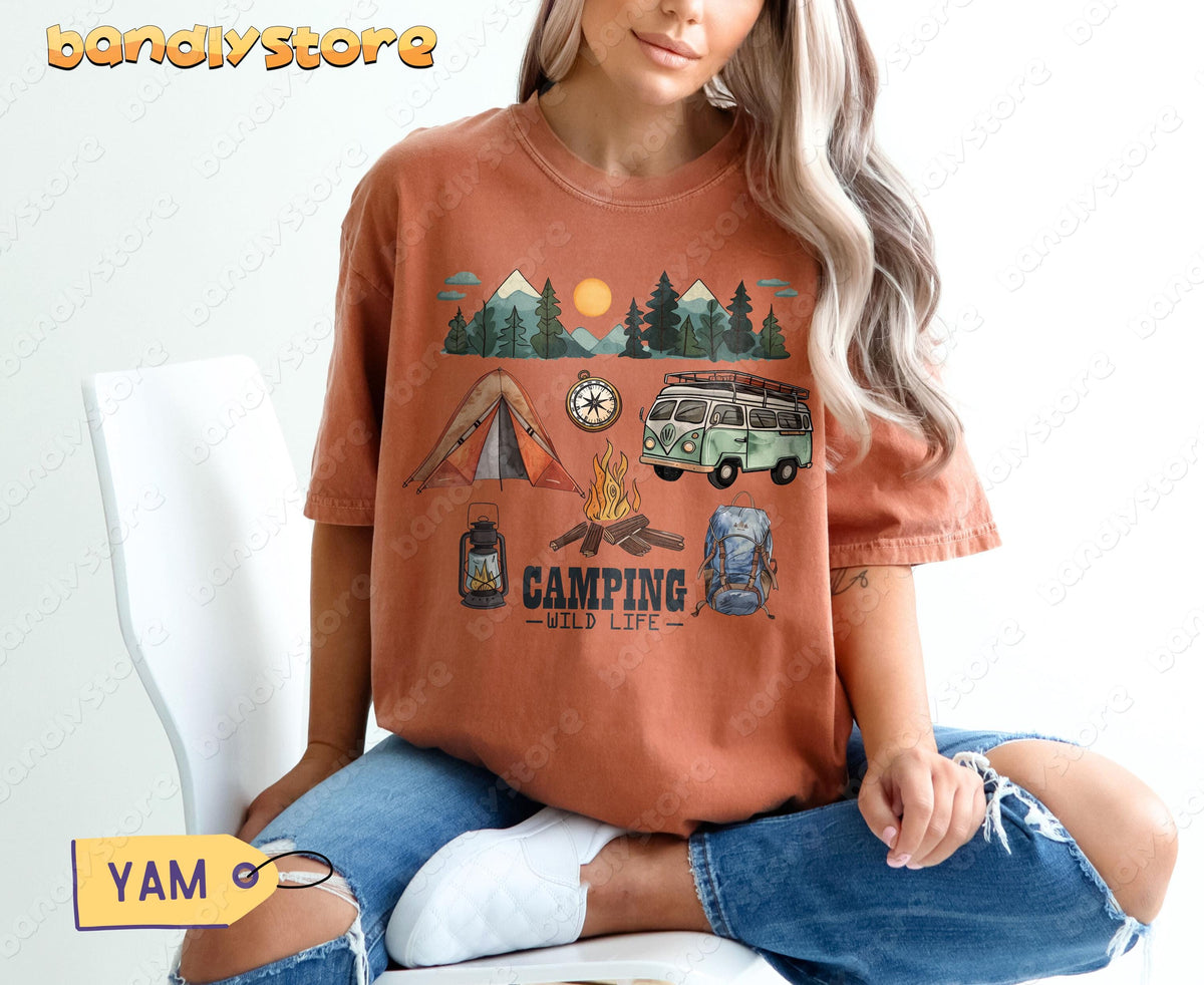 Happy Camper T-Shirt in Yam, worn by a seated model showing tent, van, campfire and mountain scene.