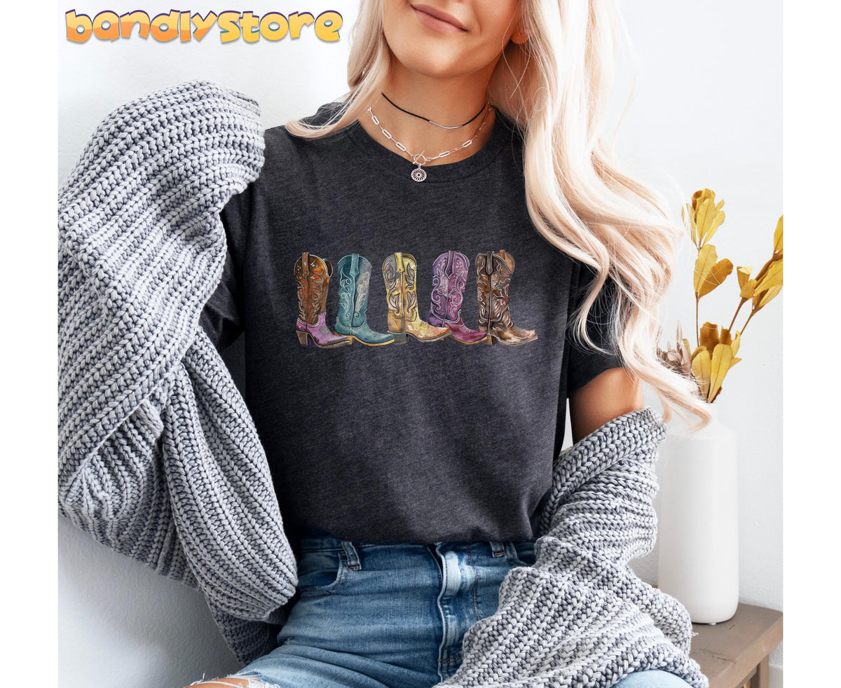Cowgirl Boots T-Shirt in dark grey heather, front torso view with grey sweater and white vase of dried leaves.