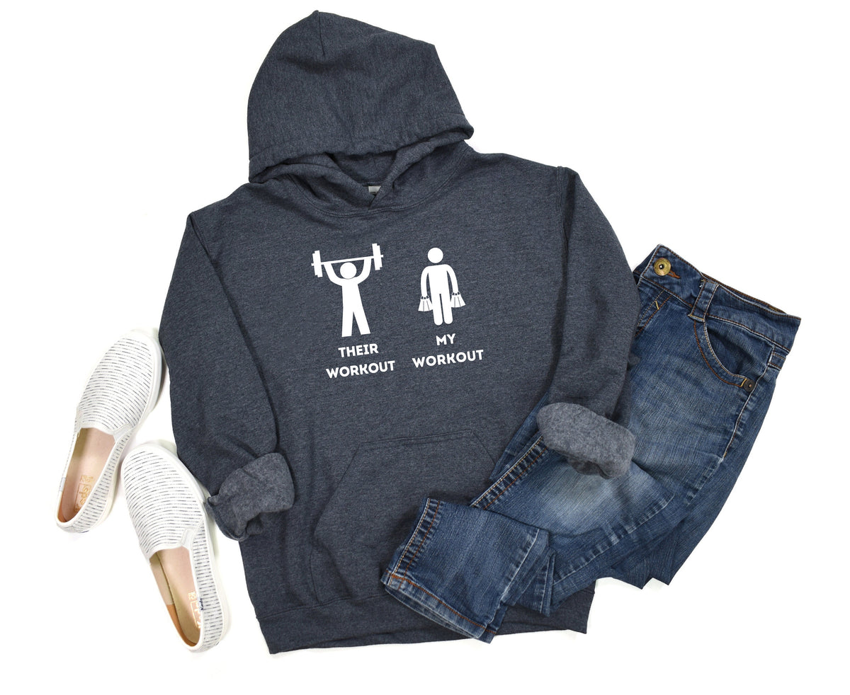 Funny Workout Hoodie in Dark Heather flat-laid beside white slip-ons and blue jeans on white.