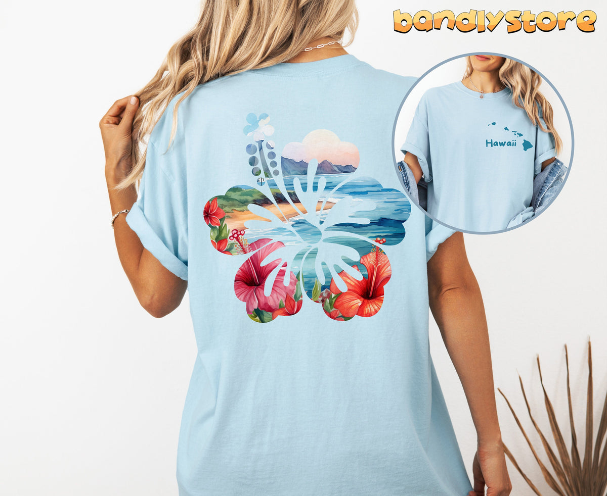 Hawaii Hibiscus T-Shirt with Back Print on a person facing away, chambray tee with hibiscus beach scene, front inset.