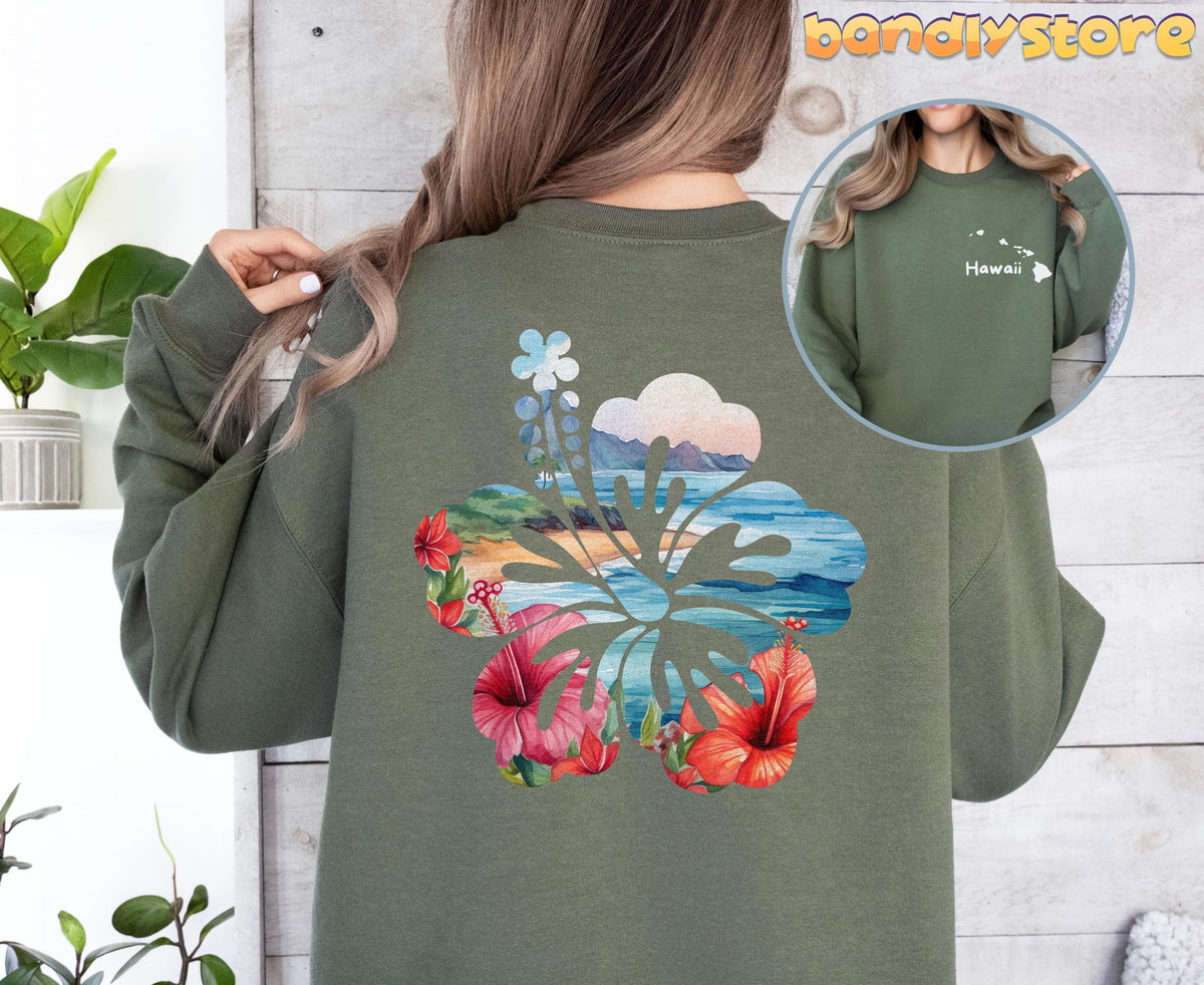 Hawaii Hibiscus Sweatshirt with Back Print in military green, rear view beside plants on wood wall with front inset.