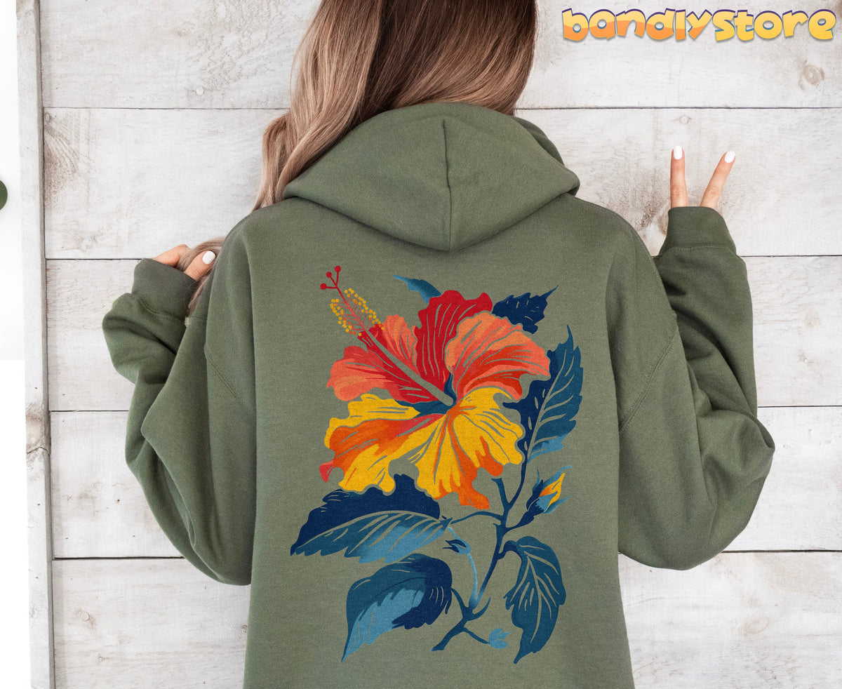 Hibiscus Flower Hoodie in military green, rear view on a person against a light wooden wall.