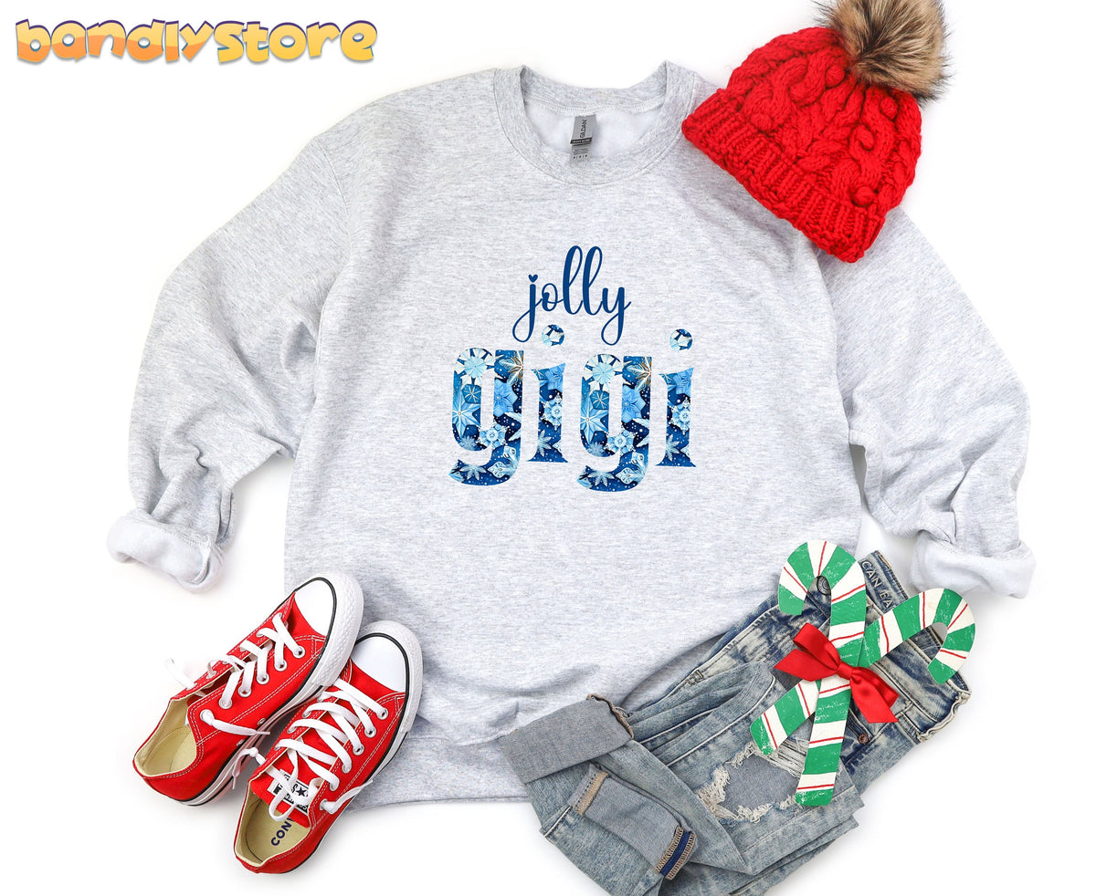 Jolly Gigi Sweatshirt in ash, flat-laid from above with a red beanie, red sneakers, jeans and candy canes.