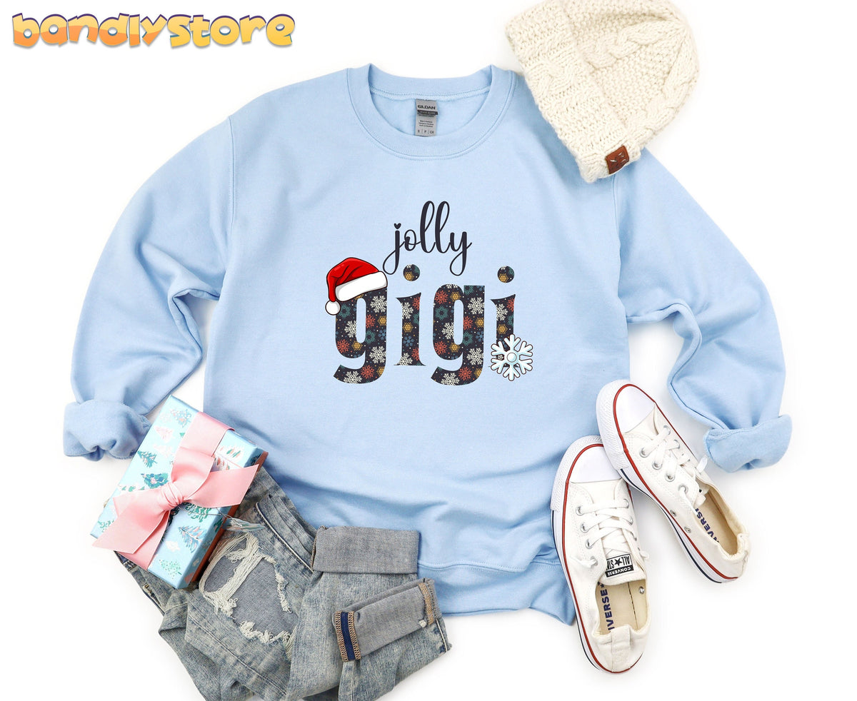 Jolly Gigi Sweatshirt in light blue top-down flat lay with beanie, sneakers, gift box and jeans.