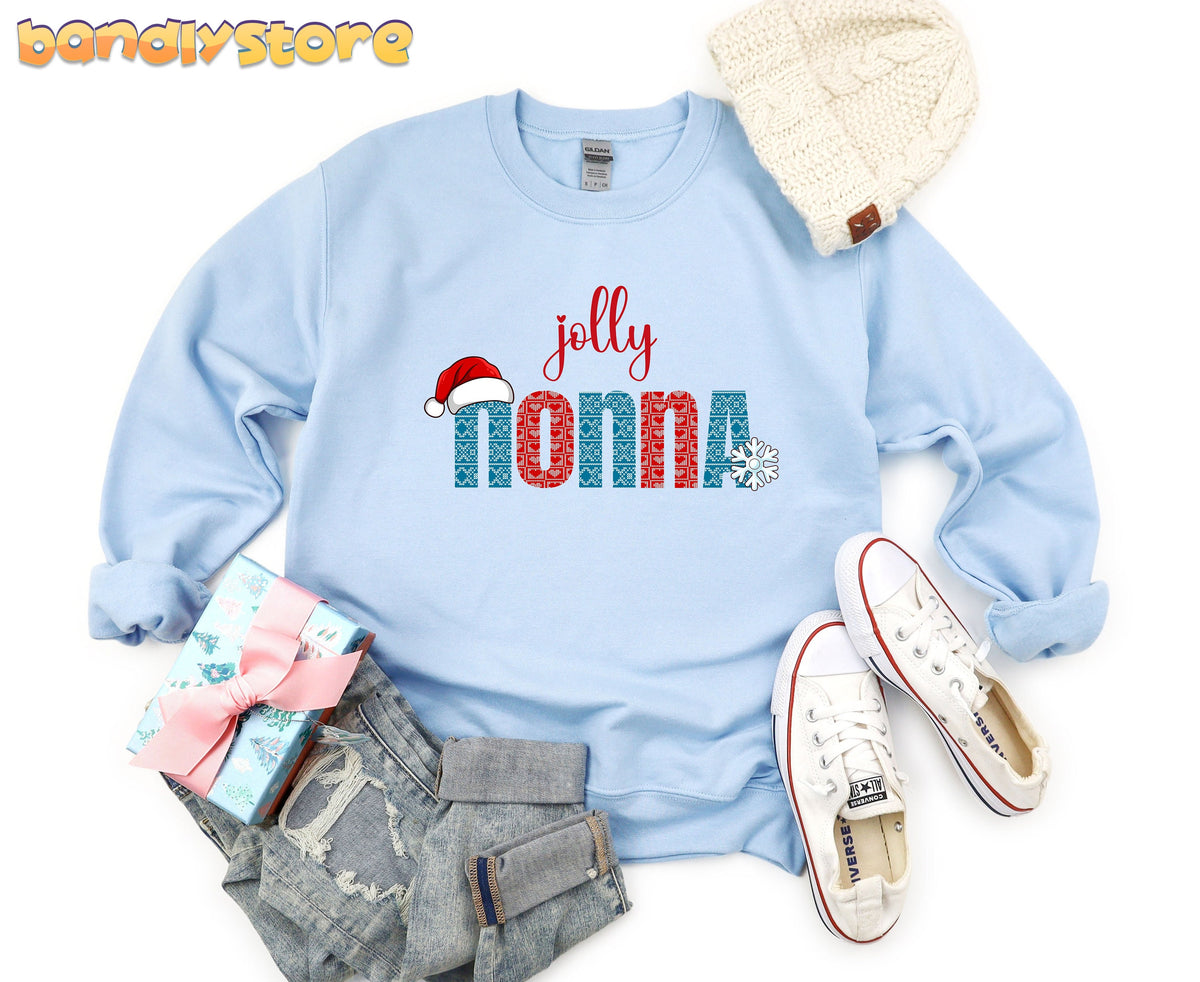 Jolly Nonna Sweatshirt in light blue laid flat from above with beanie, sneakers, jeans and gift.