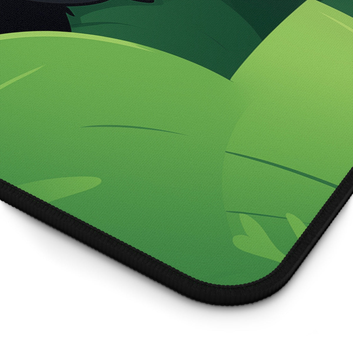 Cute Kawaii Black Cat Desk Mat detail corner view with green leaf pattern and black stitched edge.