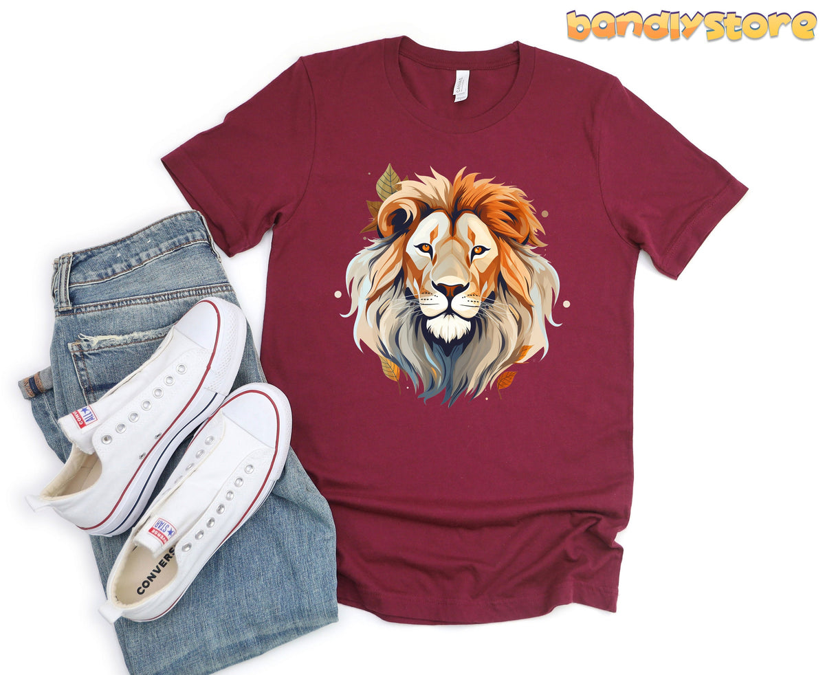 Majestic Lion T-Shirt in maroon flat-laid beside jeans and white sneakers.