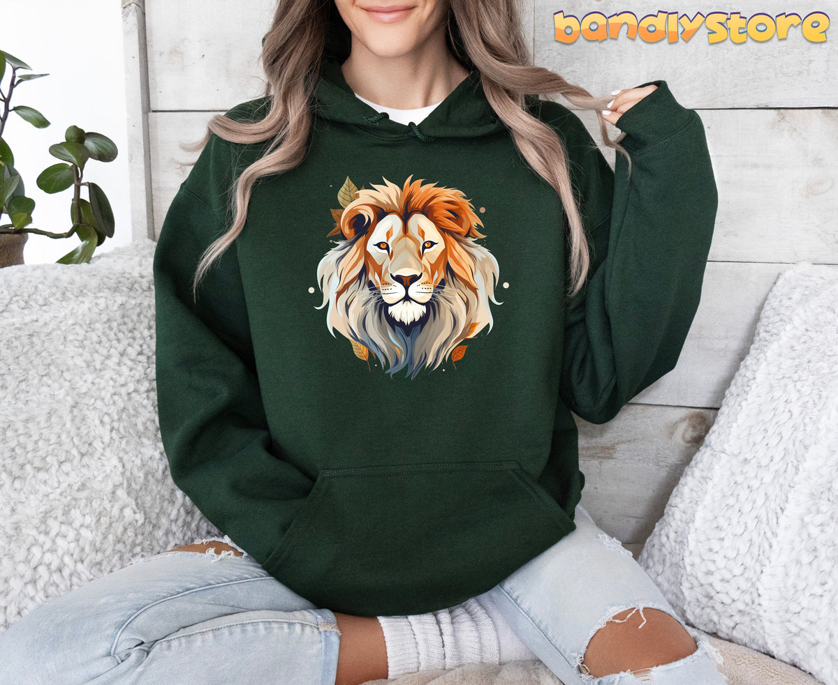 Majestic Lion Hoodie in forest green, worn front-facing by a seated model among white cushions and a plant.