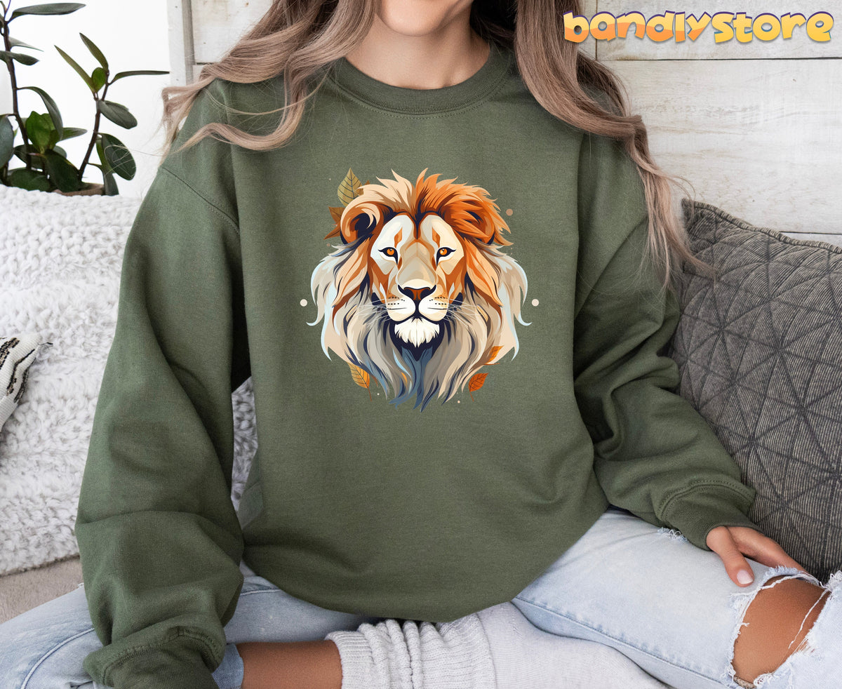 Majestic Lion Sweatshirt in military green, worn front-facing indoors by a seated person among pillows and a plant.
