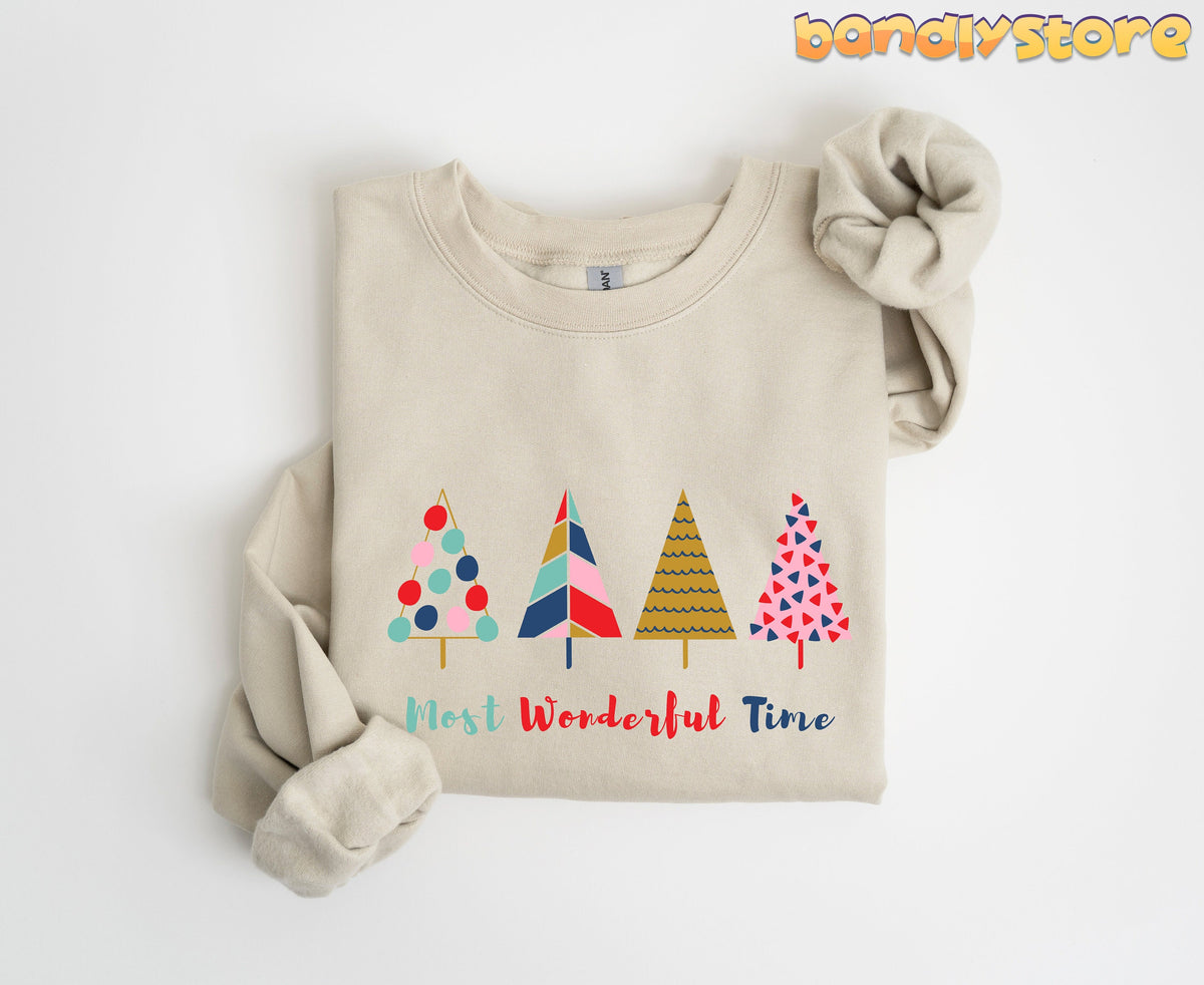 Most Wonderful Time Christmas Trees Sweatshirt in sand, folded flat on white with four patterned trees and text.