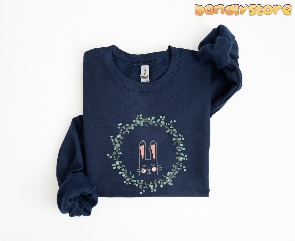 Spring Wreath Bunny Sweatshirt navy folded flat on plain white background with rolled sleeves.