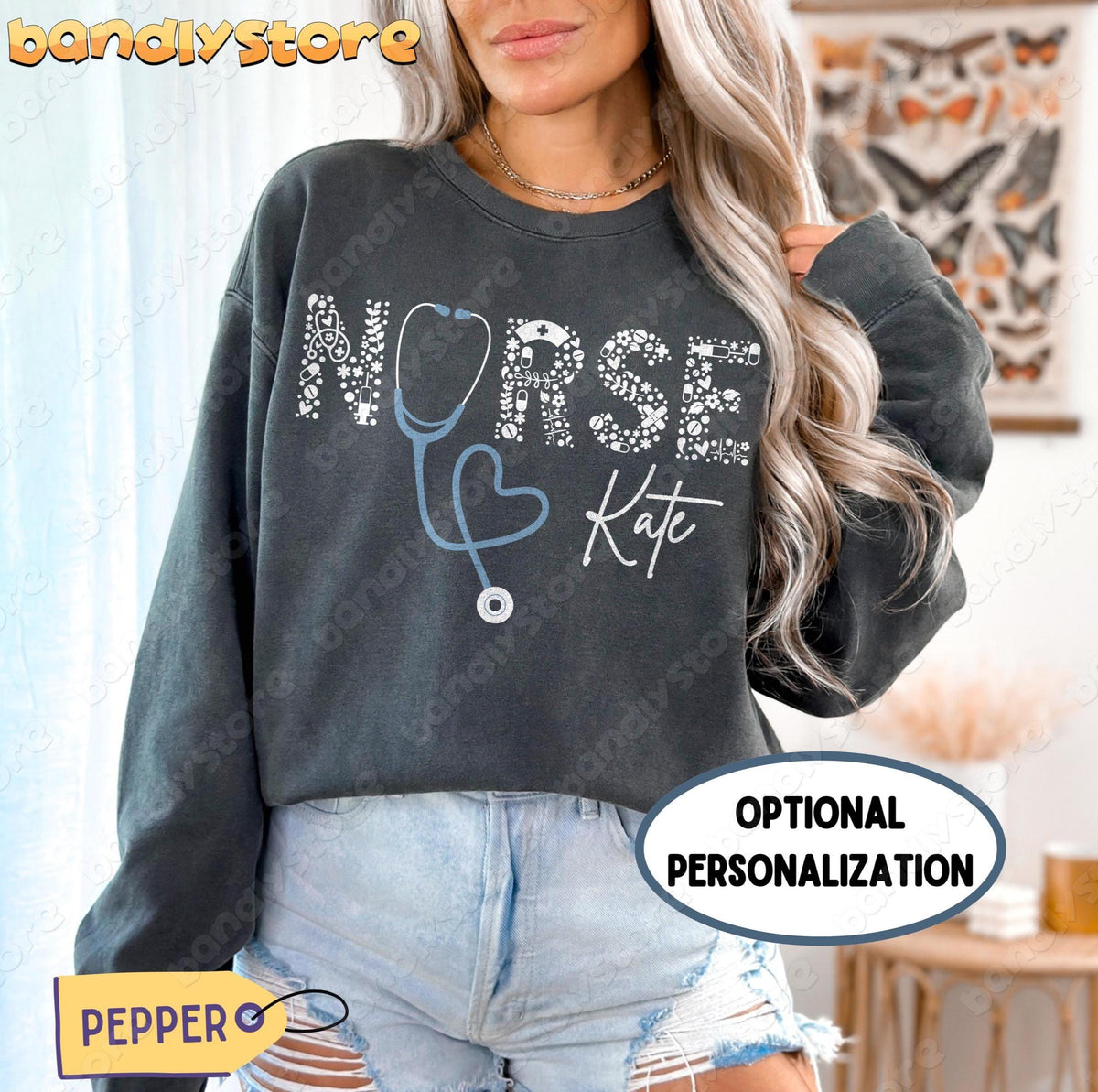 Personalized Nurse Sweatshirt in Pepper on a model facing forward indoors with sheer curtains and butterfly art.