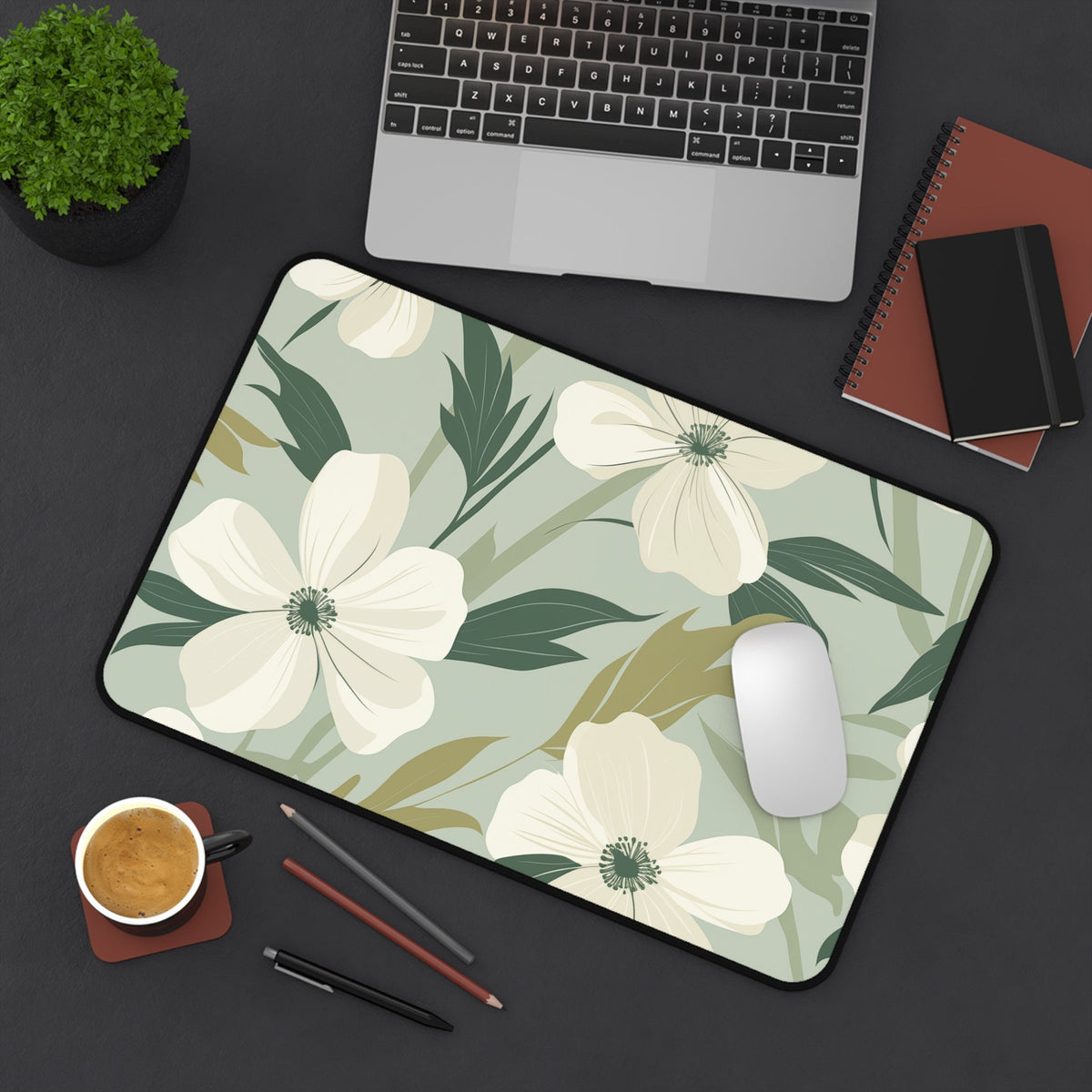 Minimalist Floral Desk Mat, 12 × 18 inches, top-down on desk with laptop, mouse, plant, notebooks, coffee and pens.