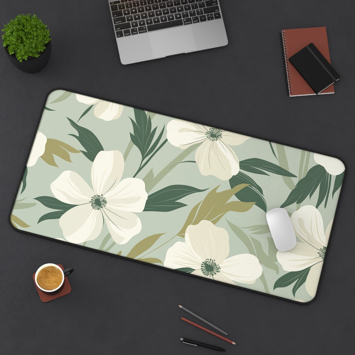 Minimalist Floral Desk Mat 16 × 32 inches top-down on a dark desk with laptop, plant, notebooks, mouse, coffee and pens.