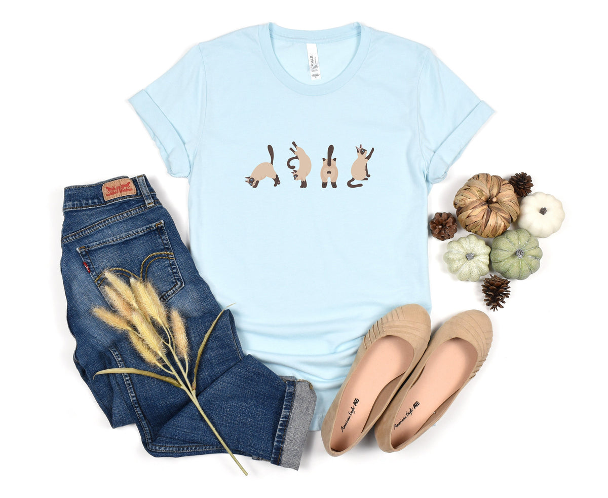 Siamese Cat T-Shirt in Heather Ice Blue flat lay with jeans, flats, pumpkins and pinecones.