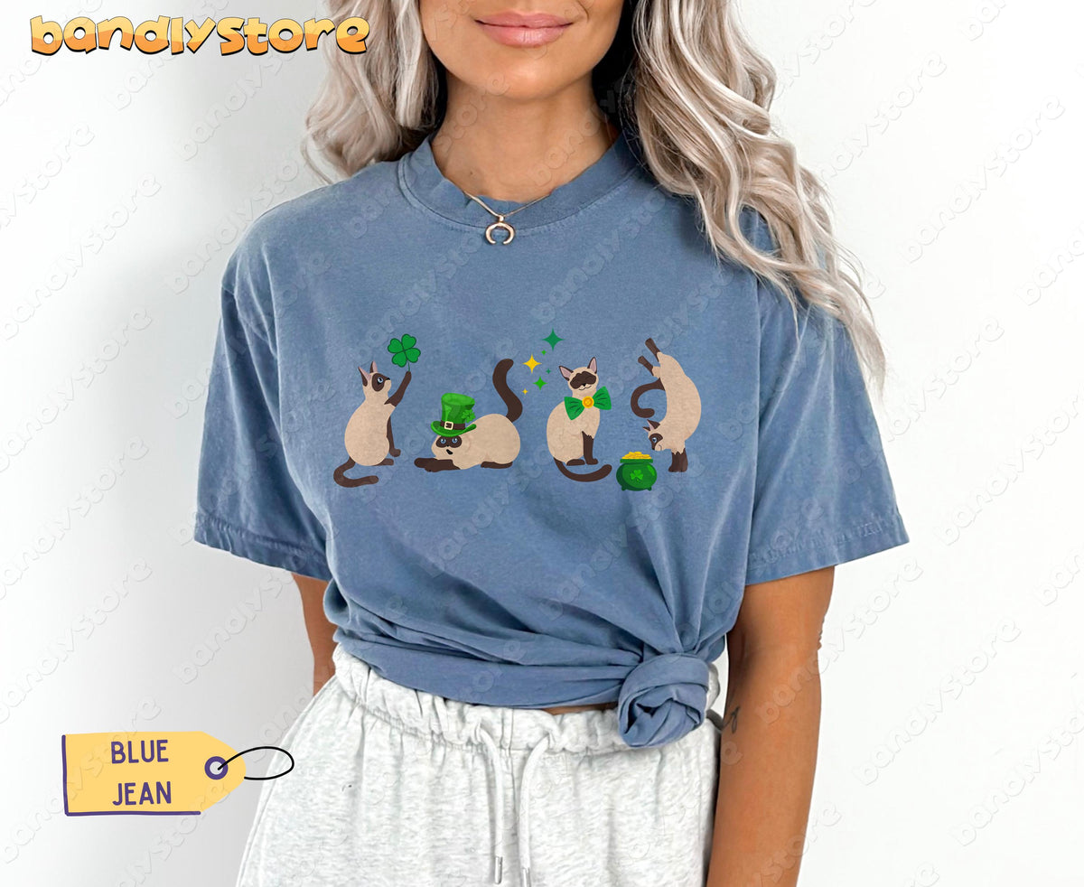 Siamese Cat Shamrock T-Shirt in Blue Jean on a front-facing model with cat graphic centered on chest.