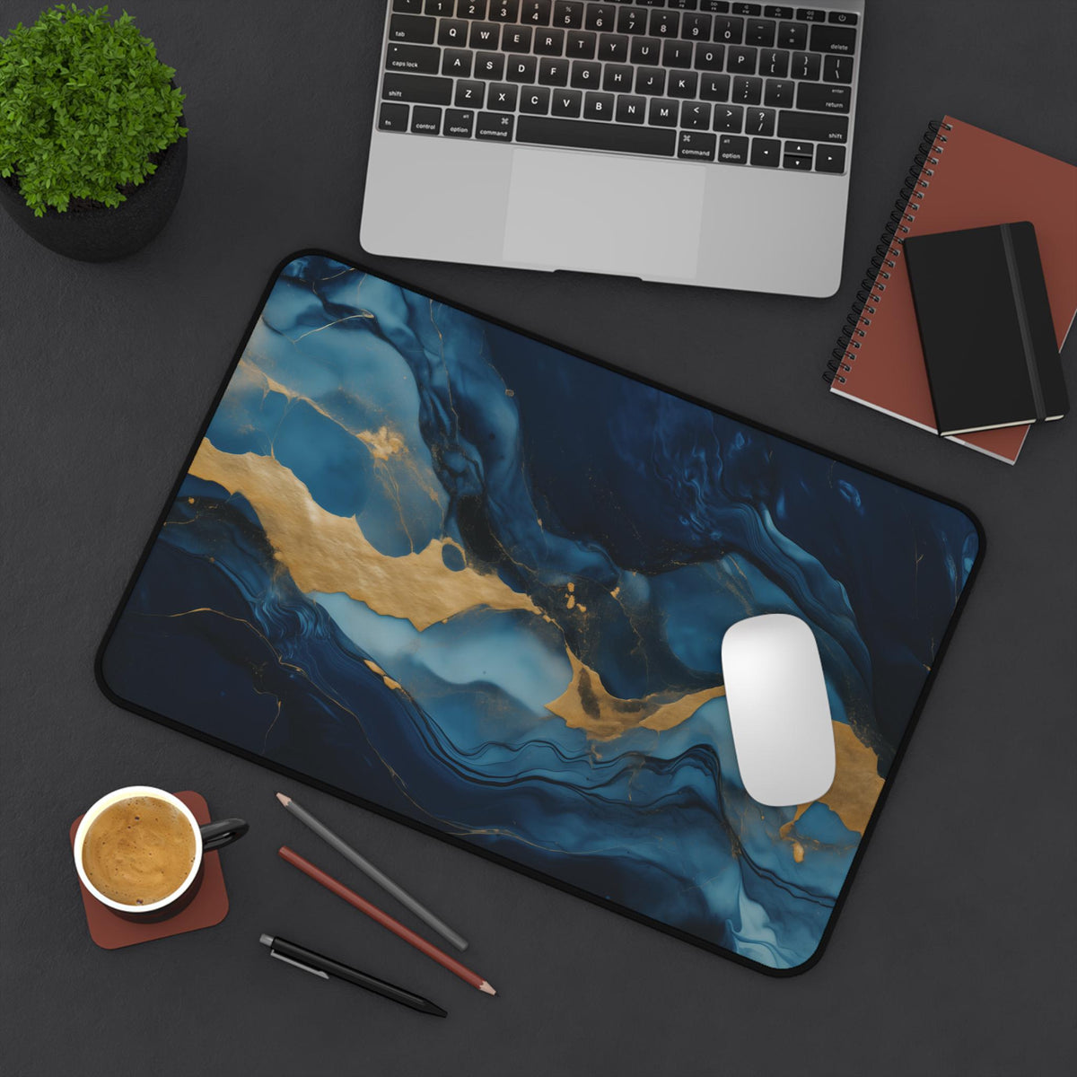 Abstract Marble Desk Mat 12 × 18 inches from above on a desk with laptop, plant, notebooks, coffee and mouse.