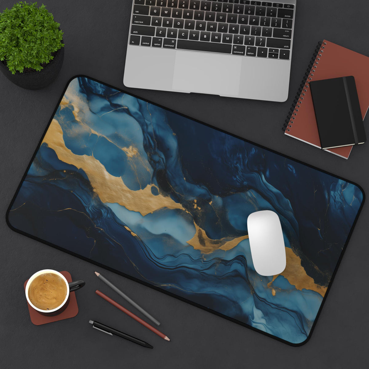 Abstract Marble Desk Mat 12 × 22 inches on a desk from above with laptop, plant, notebooks, coffee, pens and mouse.
