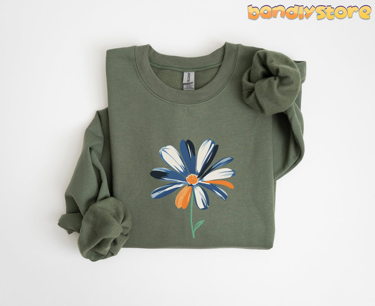 Cute Abstract Daisy Sweatshirt in Military Green folded flat on a plain white background.