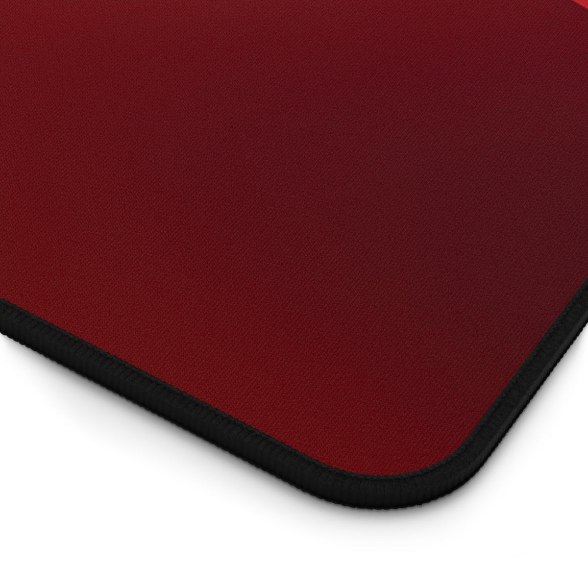 Abstract Red Wave Desk Mat close-up of red textured corner with black stitched edge on white.