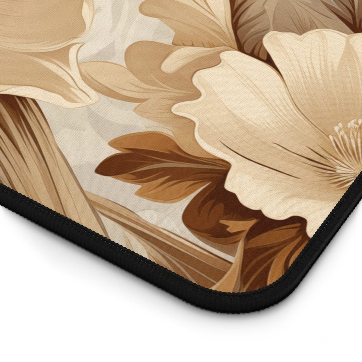 Art Nouveau Floral Desk Mat detail of the black-stitched corner with floral pattern on white.