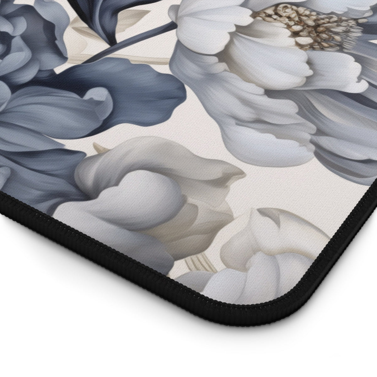 Art Nouveau Floral Desk Mat close-up corner view with black stitched edge and floral print.