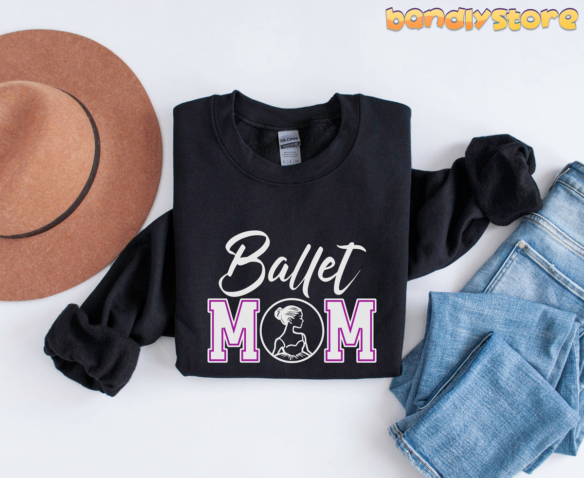 Ballet Mom Sweatshirt in black laid flat from above beside a brown hat and blue jeans.