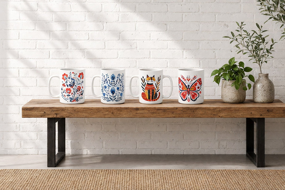 Four Scandinavian folk art ceramic mugs on a wooden console table against a sunlit white brick wall