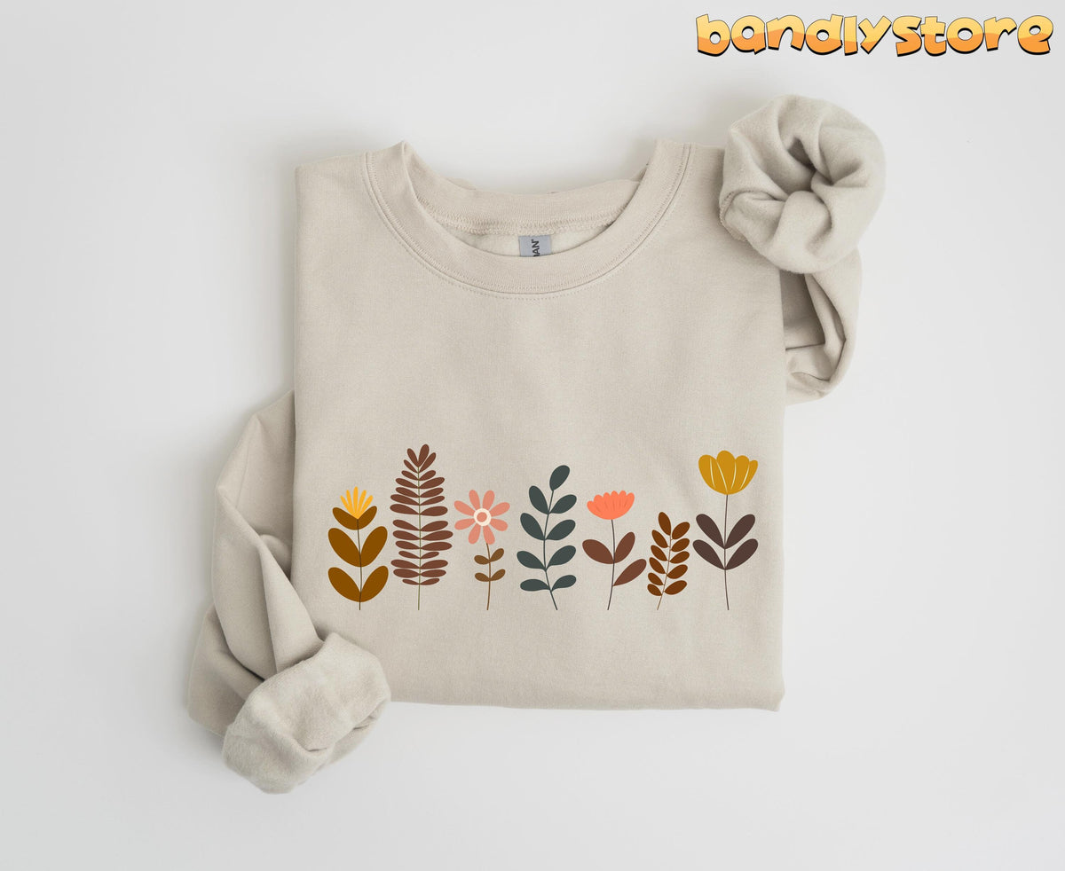 Cute Boho Wildflowers Sweatshirt in Sand folded flat on plain white background.