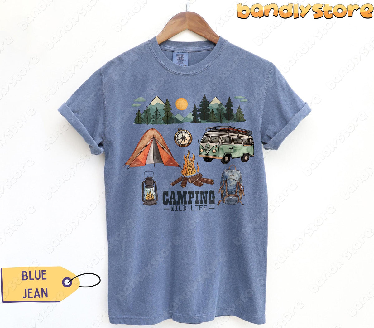 Happy Camper T-Shirt in Blue Jean on a hanger, front view with tent, van, campfire and mountain scene.