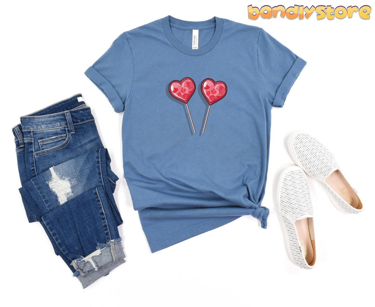 Cute Candy Hearts T-Shirt in steel blue flat-laid with ripped jeans and white slip-ons.