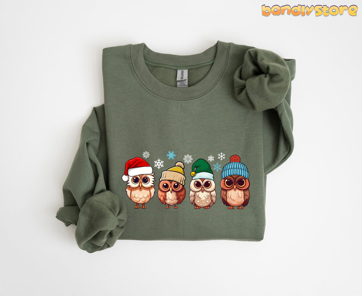 Cute Christmas Owl Sweatshirt in military green folded flat on a plain white background.