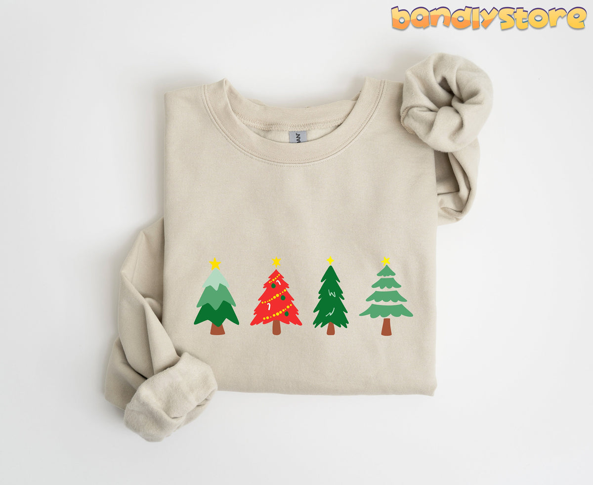 Oh Christmas Tree Sweatshirt in sand, folded flat on white, four cartoon trees across the chest.
