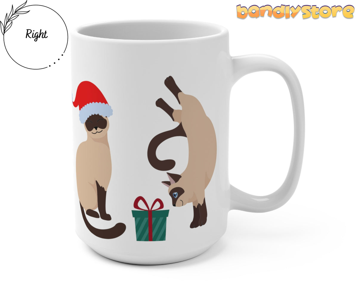 Christmas Siamese Cat Mug shown from the right on white, with two cats, Santa hat and green gift.