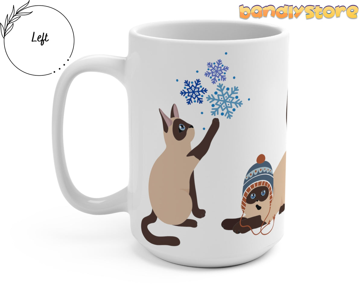 Christmas Siamese Cat Mug angled to show left side with handle, Siamese cats and snowflakes on plain background.