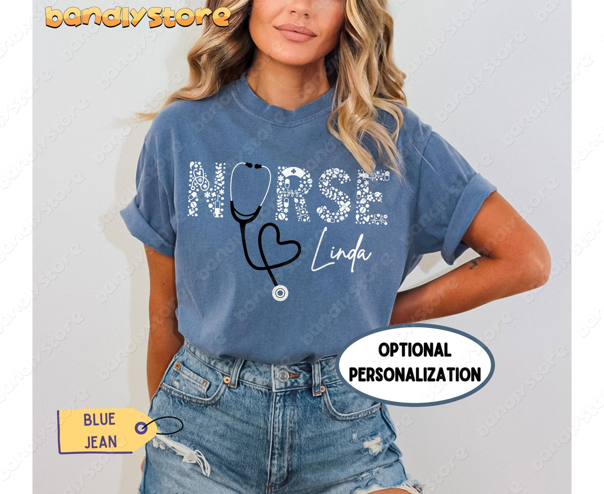 Custom Name Nurse T-Shirt in Blue Jean on a model facing forward against a plain wall.