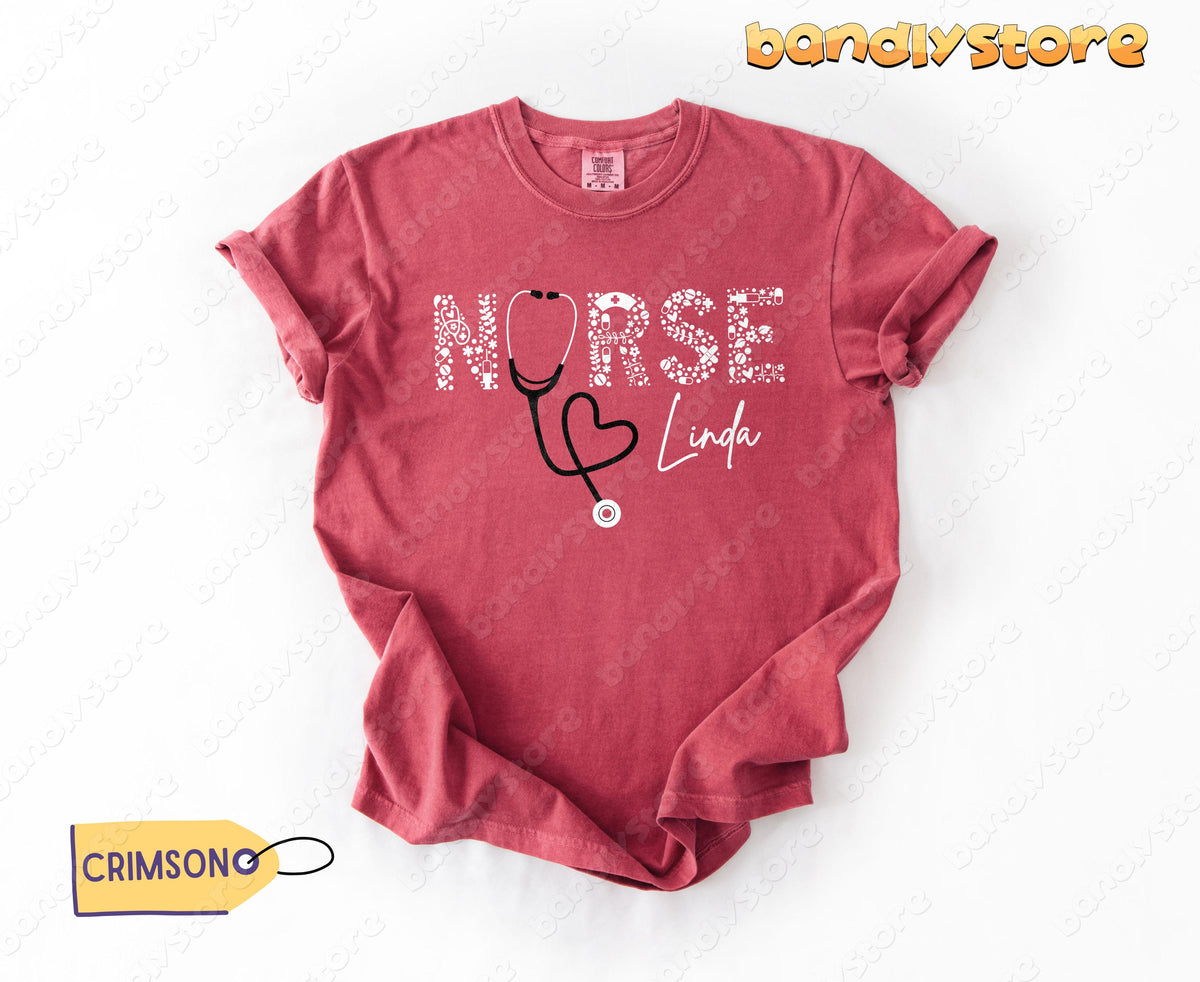 Custom Name Nurse T-Shirt crimson laid flat on white background in top-down view.