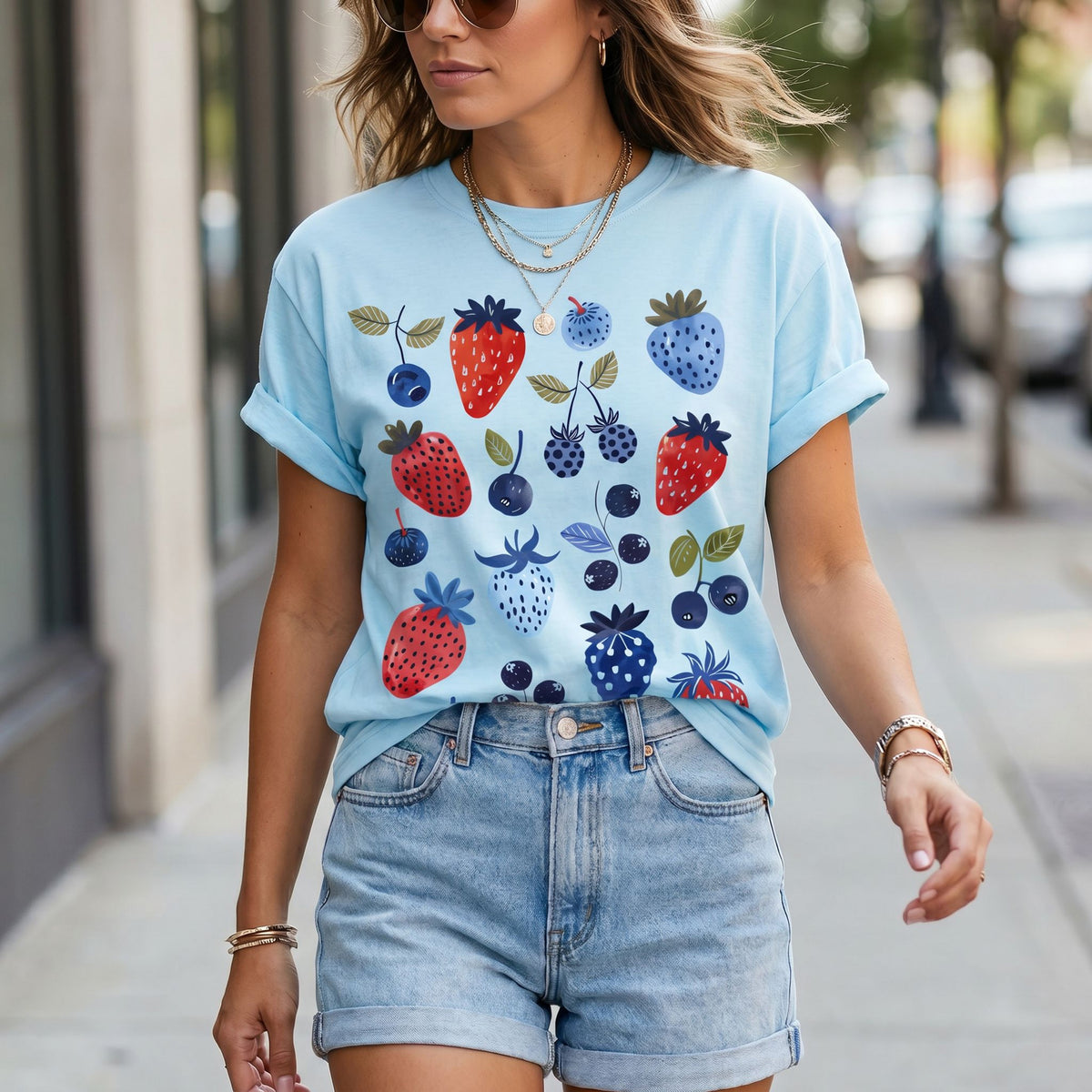 Cute Berry T-Shirt in chambray on a model walking a city sidewalk, front view.