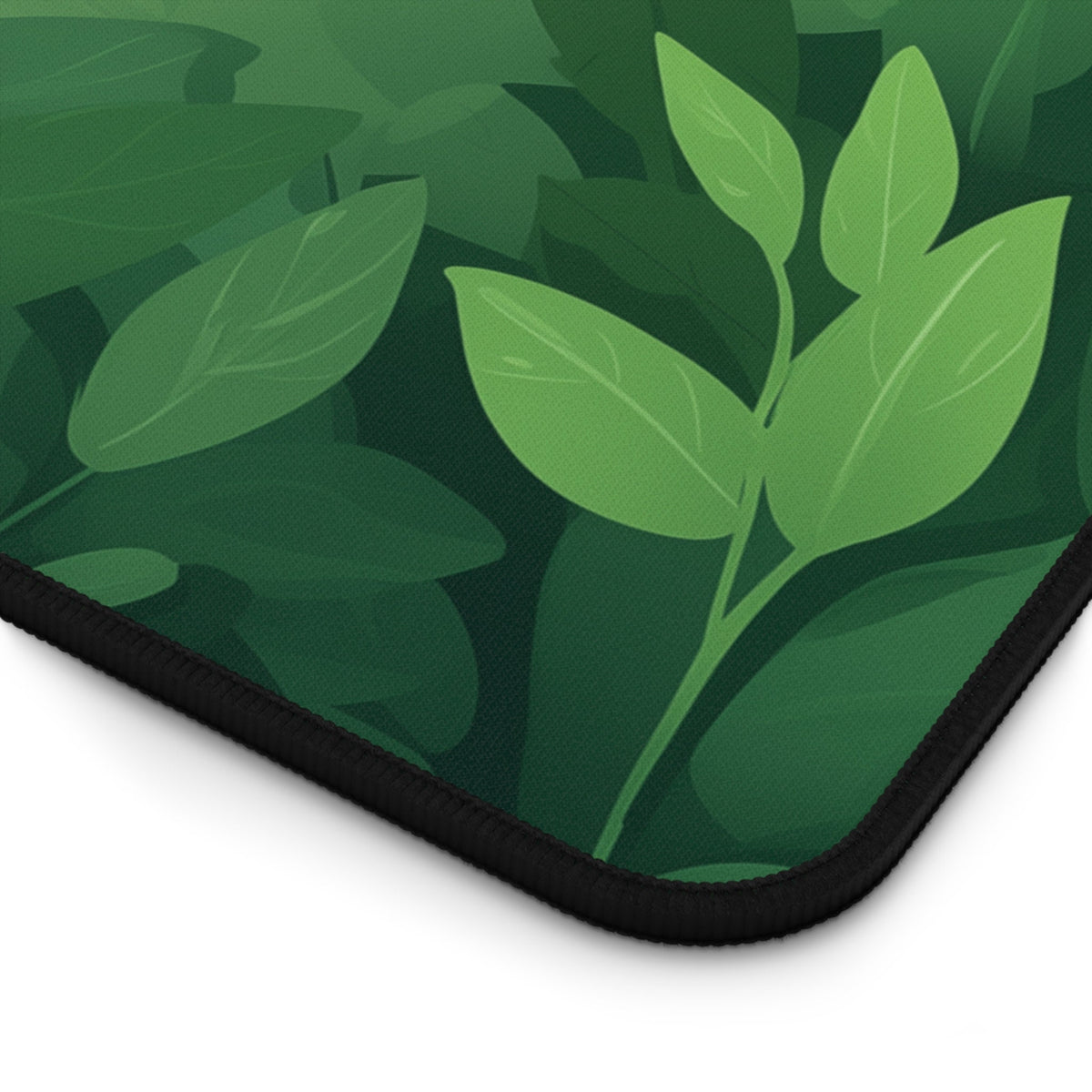 Cute Kawaii Panda Desk Mat close-up corner angle with green leaf pattern and black stitched edge on white.