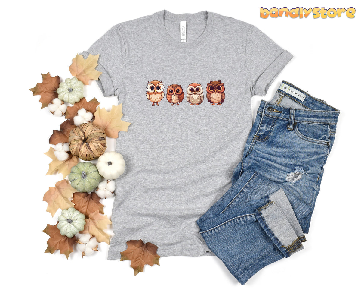 Cute Owl T-Shirt in Athletic Heather flat-laid from above with autumn leaves, pumpkins, cotton and jeans beside it.