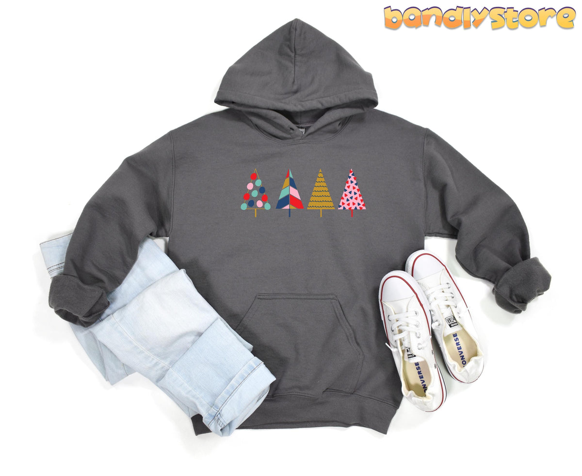 Cute Pine Trees Hoodie in charcoal, flat lay with light jeans left and white sneakers right.