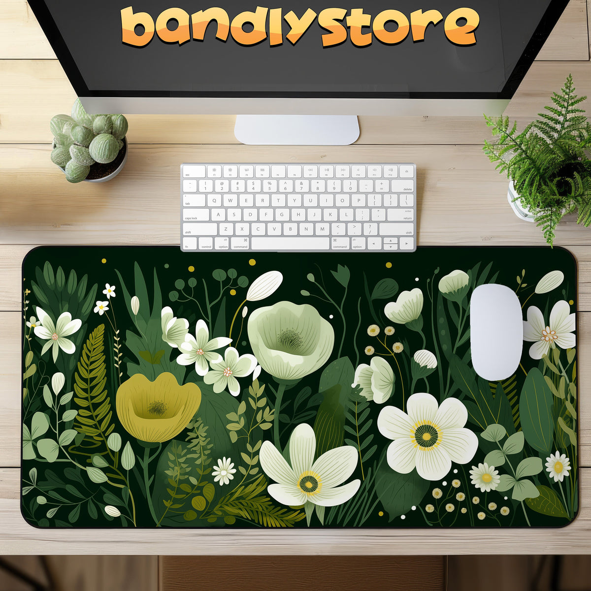 Dark Floral Desk Mat in top-down desk view with monitor, keyboard, mouse and plants.