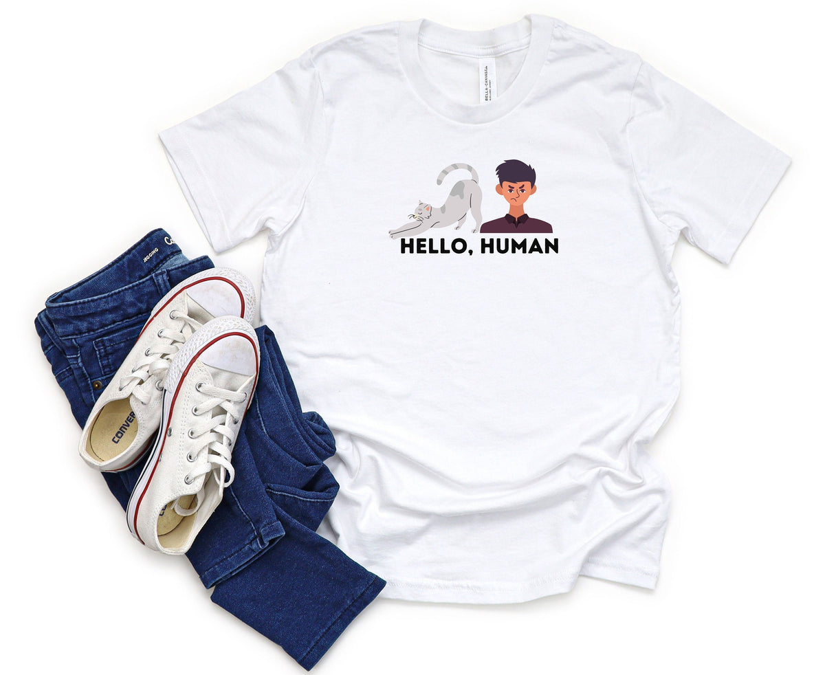 Funny Cat Butt T-Shirt white tee flat-laid with blue jeans and white sneakers, cat rear and annoyed man graphic.