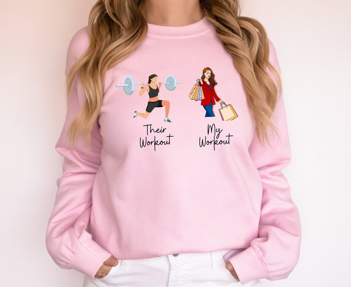 Funny Fitness Sweatshirt on a light pink crewneck, front view of a person, gym lifter labeled Their Workout beside shopper labeled My Workout.