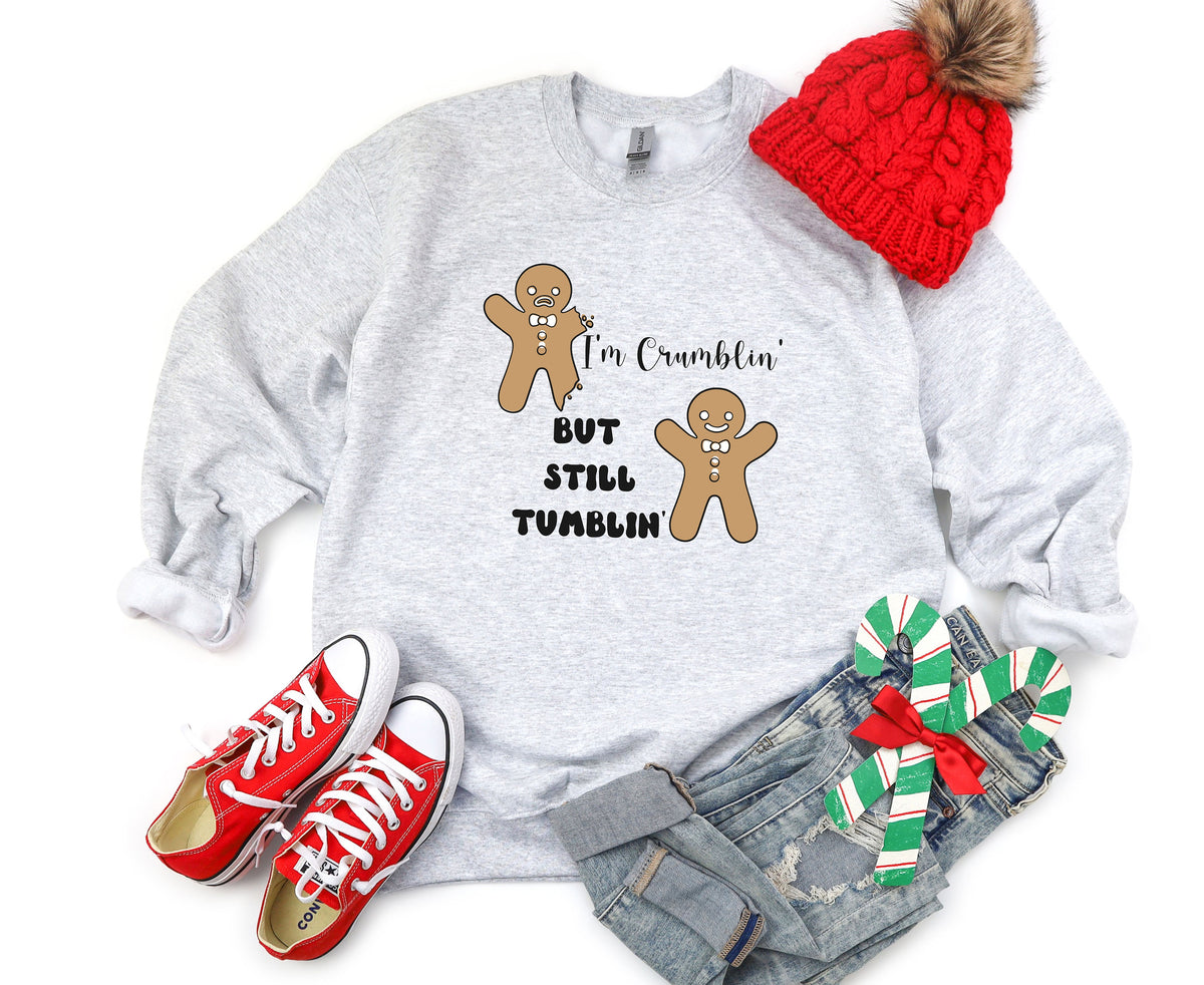Funny Gingerbread Man Sweatshirt flat-lay on white with red beanie, red sneakers, jeans and candy canes.